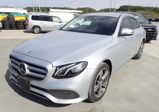 2016 Mercedes-Benz E-Class 4Matic, silver sedan for sale at Rahaman & Sons, Success — arriving soon
