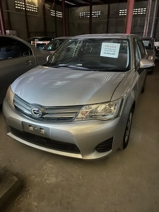 2012 Toyota Corolla Axio, silver sedan for sale at Rahaman & Sons, Success — in stock