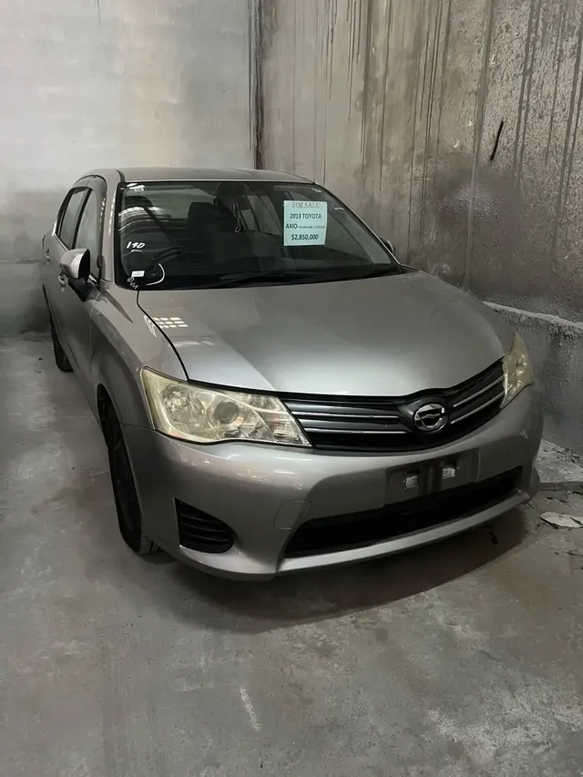 2013 Toyota Corolla Axio, silver sedan for sale at Rahaman & Sons, Success — in stock