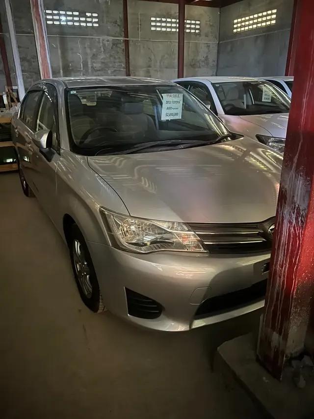 2013 Toyota Corolla Axio, silver sedan for sale at Rahaman & Sons, Success — in stock