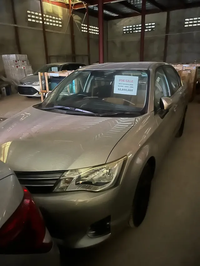 2013 Toyota Corolla Axio, gold sedan for sale at Rahaman & Sons, Success — in stock