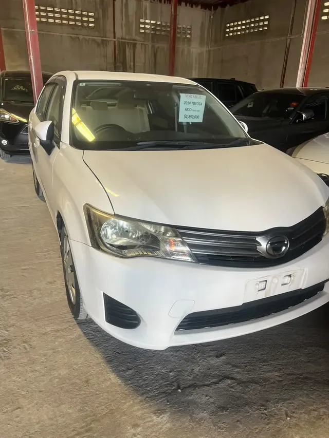 2014 Toyota Corolla Axio, white sedan for sale at Rahaman & Sons, Success — in stock